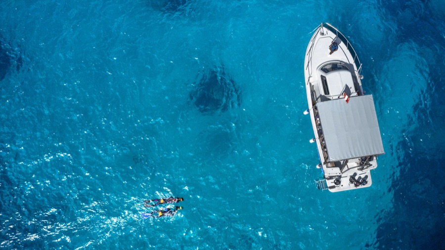 Aerial view of snorkellers in crystal water