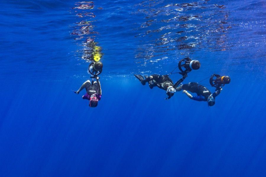 Group underwater with DPV scooters